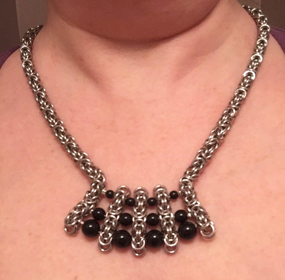 Stainless Steel Byzantine with graduated onyx beads
