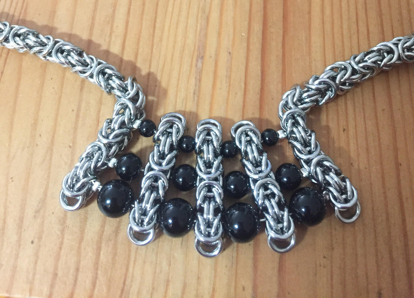 Stainless Steel Byzantine with graduated onyx beads