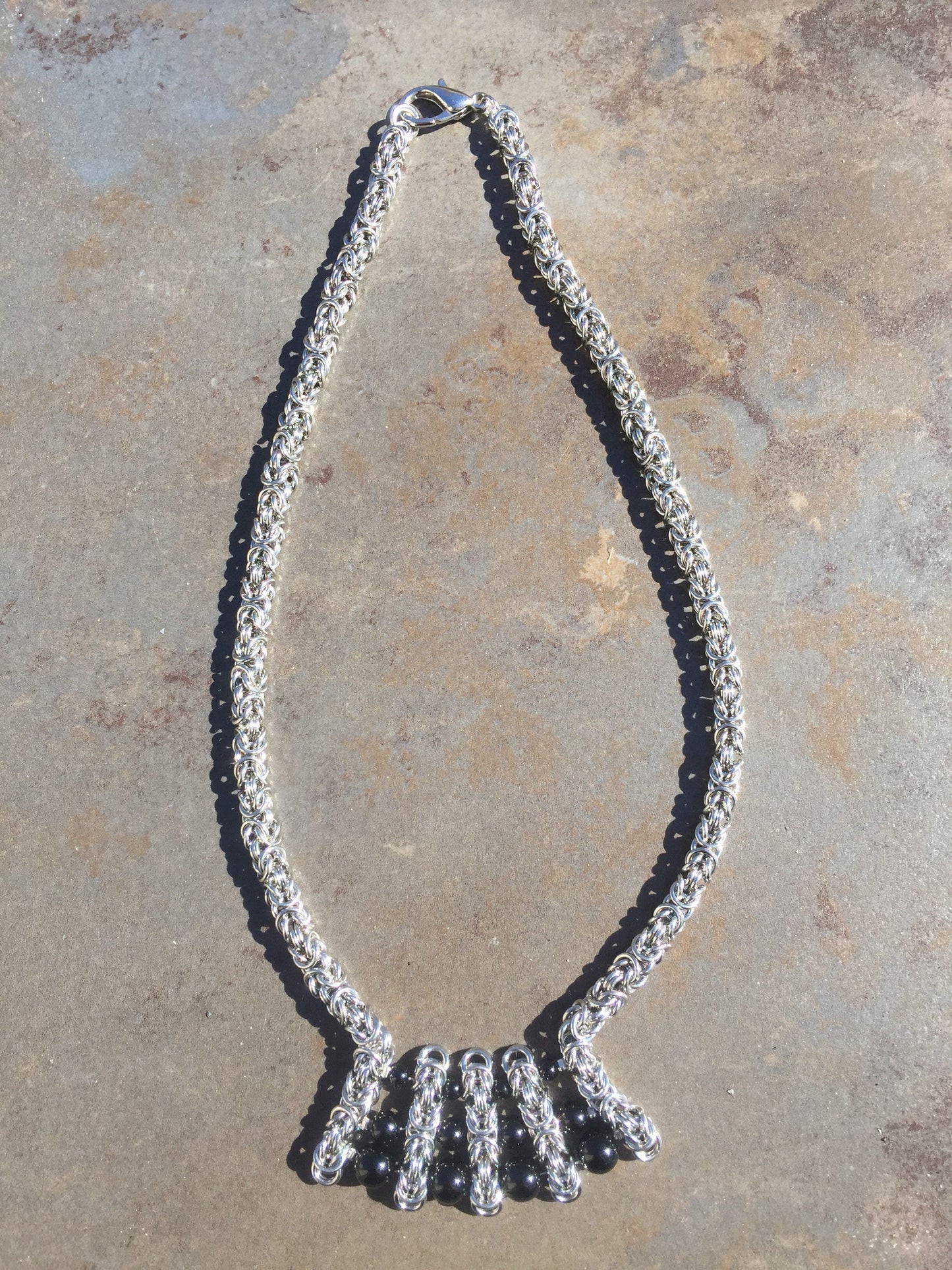 Stainless Steel Byzantine with graduated onyx beads