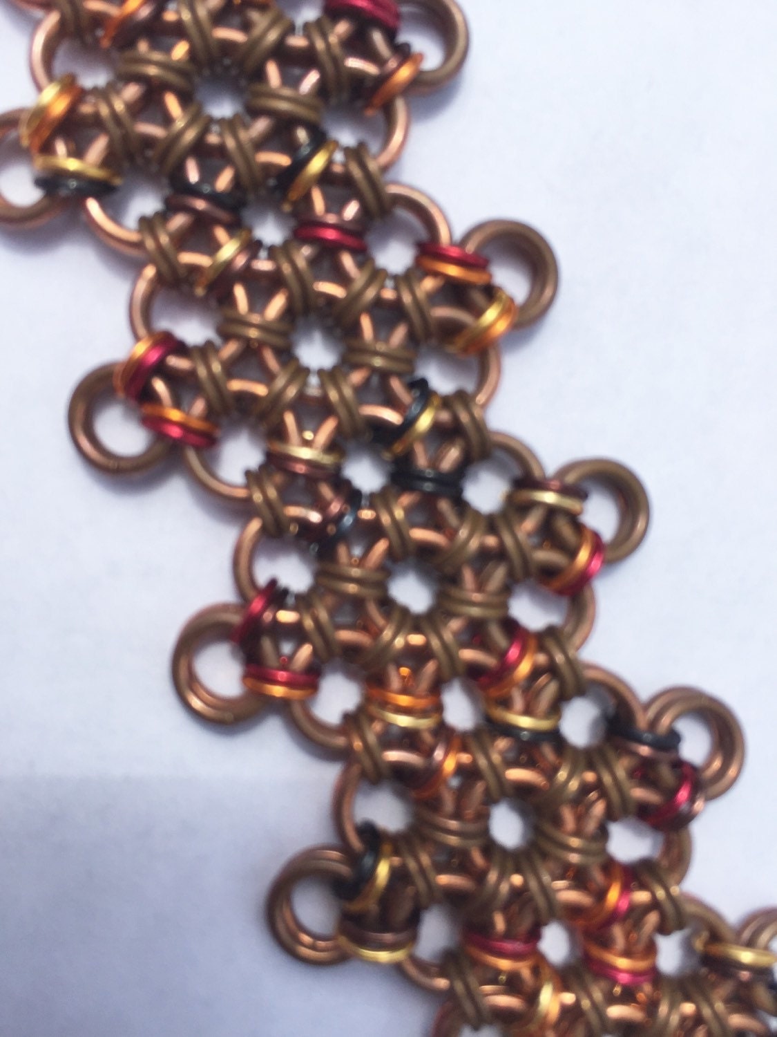 Japanese diamond weave, patina-ed copper anodized aluminum accents